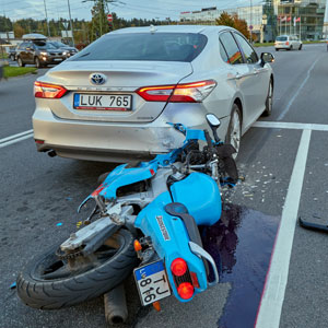 Motorcycle accident scene with damaged bike | Pigott Law Group