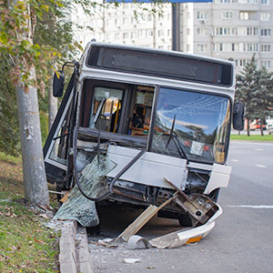 A damaged school bus, illustrating the bus accident - Pigott Law Group