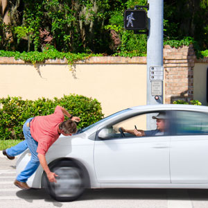 Car accident in a crosswalk, showcasing road safety concerns. - Pigott Law Group