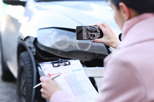 Car accident inspection in progress for a personal injury lawsuit in New York - Pigott Law Group