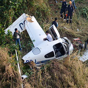 Private plane crash wreckage in a field; legal representation for aviation injuries in Buffalo, NY.