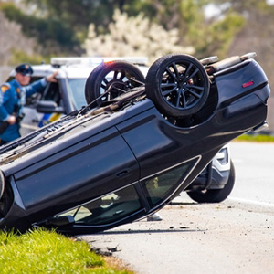 Overturned car after a rollover accident; legal help for motor vehicle injury claims in Buffalo, NY.